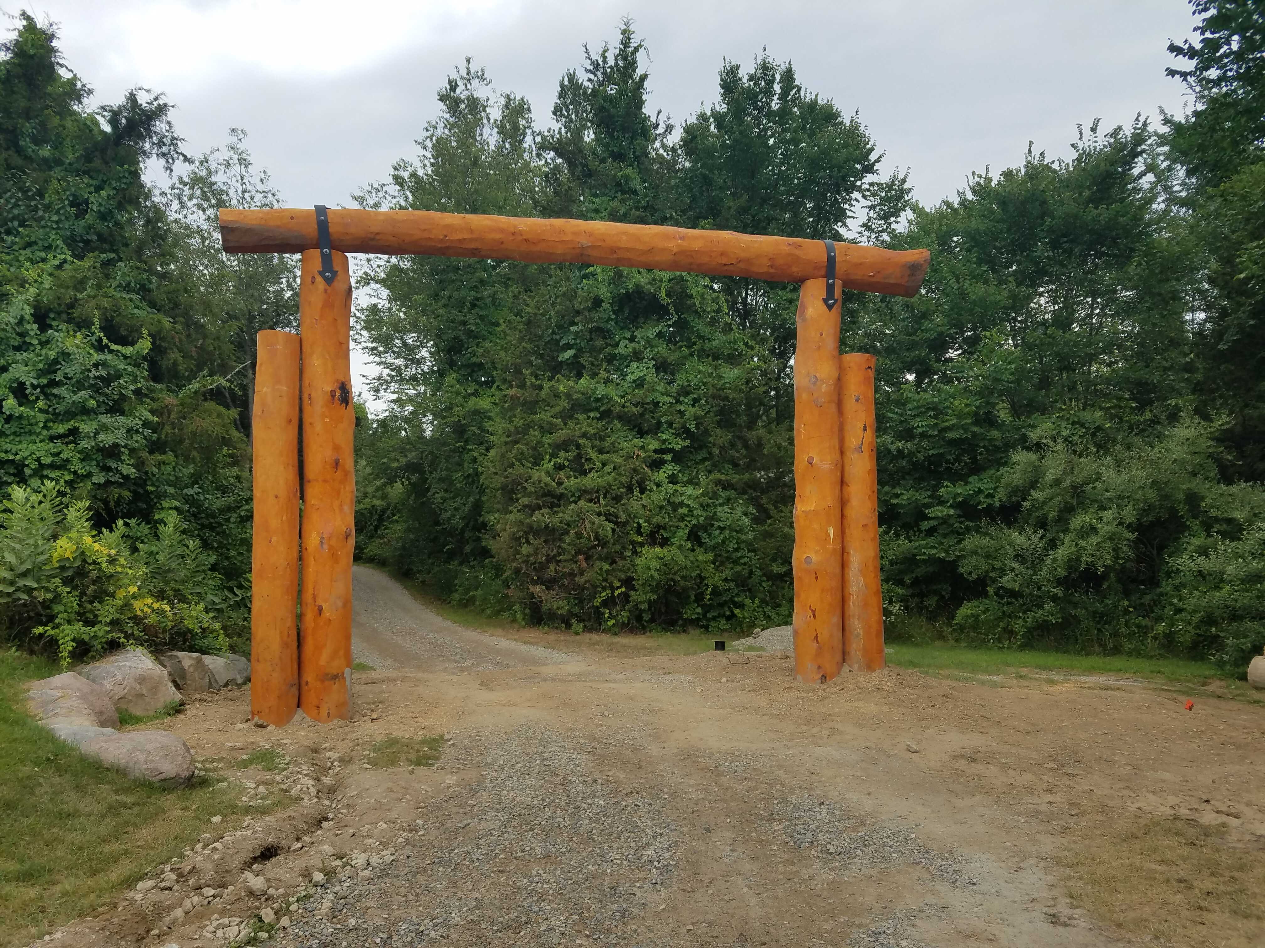 A rustic log gateway.